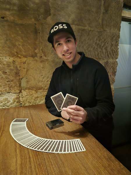 TDog mid-performance, close-up card magic